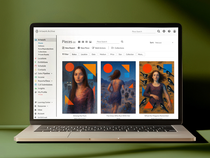 Laptop showing artwork grid interface