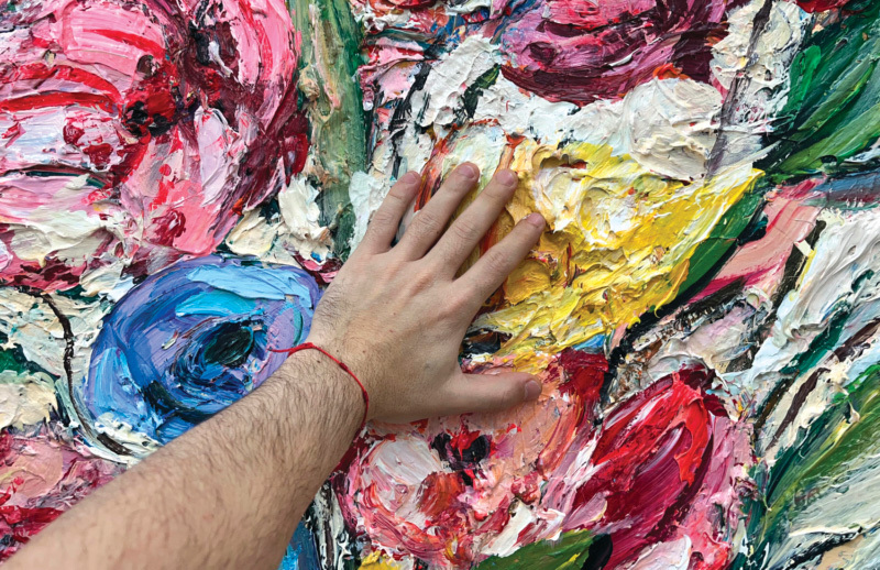 A hand on a painting
