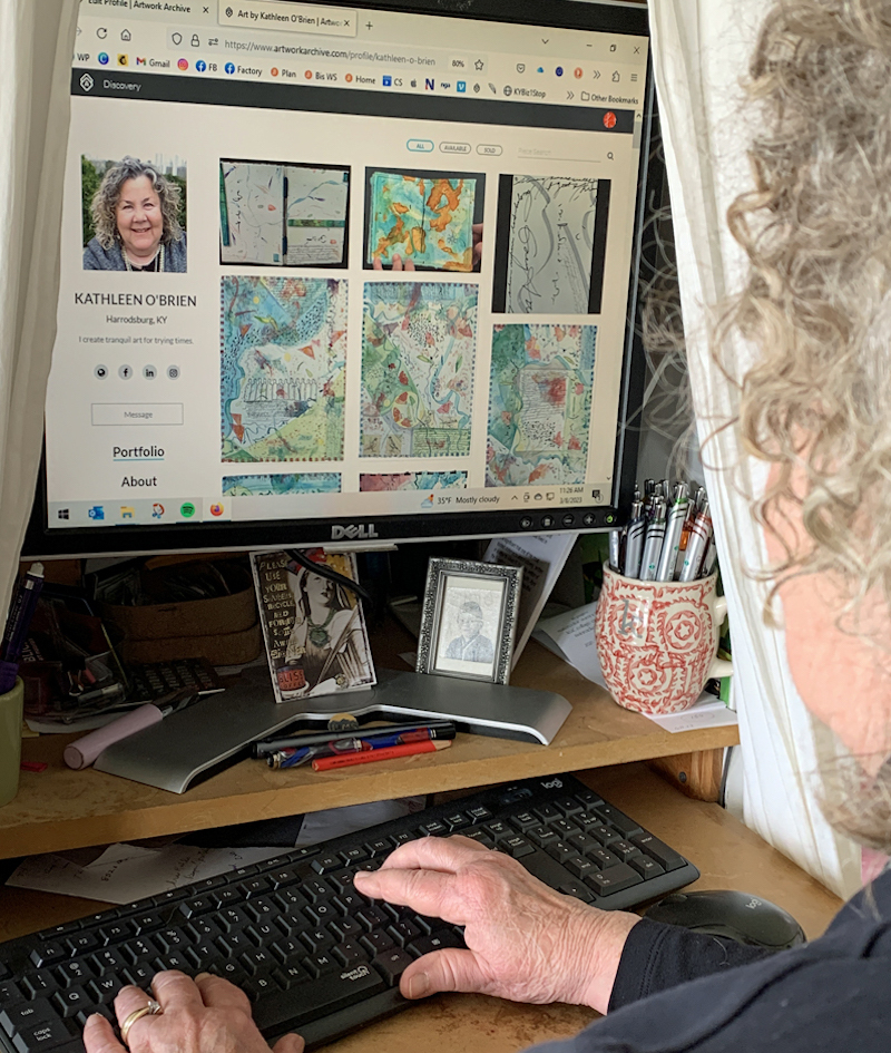 An individual looking at a computer an using her Artwork Archive Public Profile.