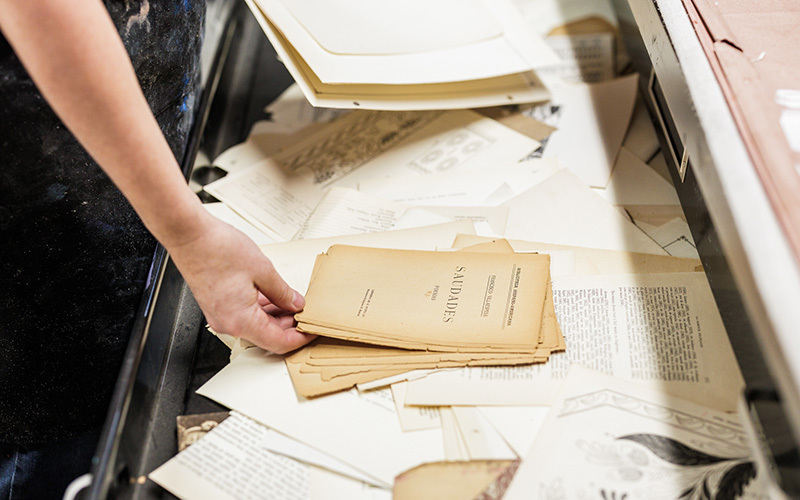 Woman holding pages from an old book